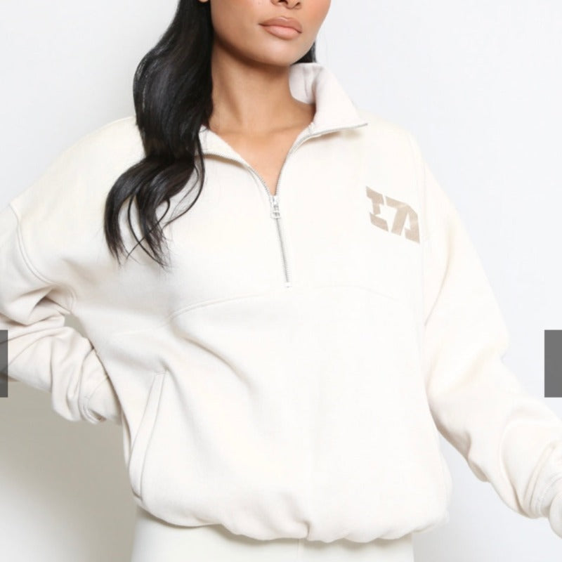 Cream iconic 1/4 zip sweater